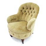 Late Victorian cream button-back upholstered tub armchair, the bowed seat upon short front turned