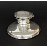 Silver capstan inkwell of circular form with an engine turned cover, Birmingham 1950, maker 'T&S',