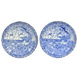 Pair of Japanese blue and white fluted porcelain chargers decorated with birds and foliate panels,
