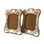 Fine pair of Art Nouveau silver and enamel photograph frames, with stylised foliate surrounds and