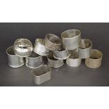 Collection of twelve assorted silver napkin rings of various dates and designs, 10oz approx (12)