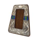 Art Nouveau silver photograph frame, the surround with entwined stylised foliage and later blue