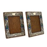 Good pair of Art Nouveau silver and enamel photograph frames, with stylised foliage on a weave