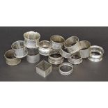 Collection of fourteen silver napkin rings of various periods and designs, 9oz approx (14)