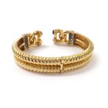 Yellow gold diamond set hinged bangle, set with ten round brilliant-cut diamonds, estimated 1.15ct