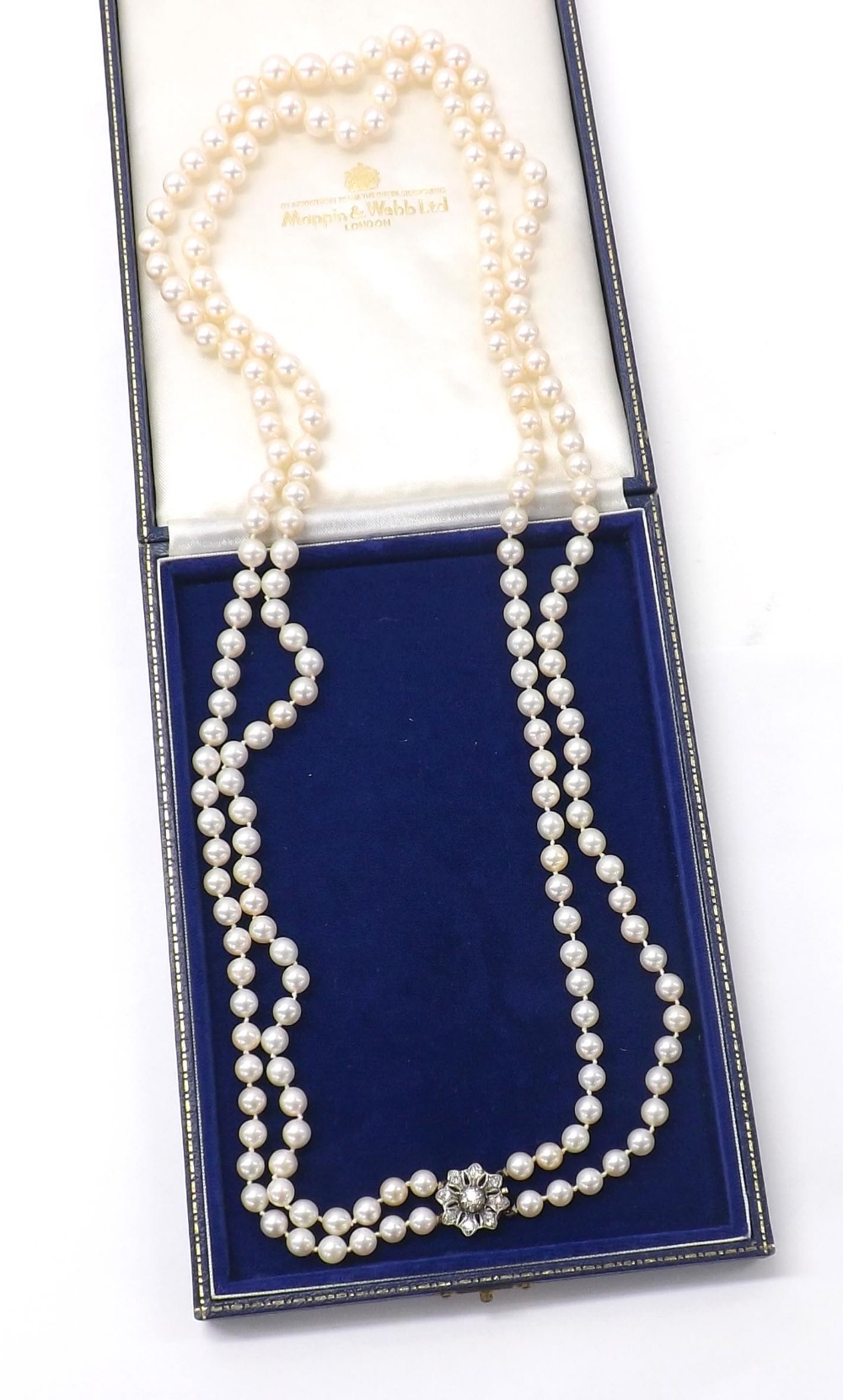 Fine quality double row of cultured pearls, graduating from 6.6mm to 9.6mm, floral white metal