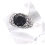 Fancy 14ct white gold black and white diamond pavé set dress ring, the central black diamond 4.