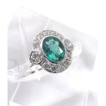 Emerald and diamond 18ct white gold oval cluster ring, the emerald estimated 1.5ct approx, in a