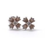 Tiffany & Co. pair of platinum round brilliant-cut diamond floral design ear studs, clarity VS-SI,