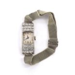 1920s platinum diamond set lady's cocktail watch, silvered dial with Arabic numerals, the case set