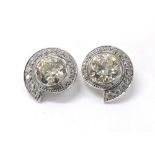 Fine and impressive pair of diamond clip earrings, each with round old Europeon-cut diamonds in a