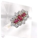 Fancy ruby and diamond cluster dress ring in the Art Deco style, with three baguette rubies in a