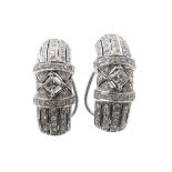 Pair of white gold diamond set earrings in the Art Deco manner, with princess and round brilliant-