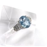 18ct white gold aquamarine and diamond ring, the oval aquamarine 3.90ct approx, in a stepped setting