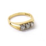 18ct yellow gold three stone diamond ring, round brilliant-cut diamonds in a white gold claw