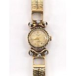 Universal 18ct lady's bracelet watch, the dial with Arabic quarter numerals, cal. 244 movement,