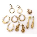 Five assorted pairs of gold earrings and a circular 9ct pendant, 17.8gm approx (one earring at