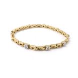 Modern 18ct yellow gold line bracelet, set with seven round brilliant-cut diamonds, estimated 0.50ct