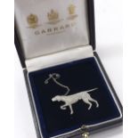 Attractive diamond novelty brooch in the form of a pointer dog, pave set with sapphire eye and