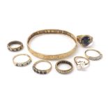 Seven assorted 9ct stone set rings and an engraved bangle (at fault), 24.2gm (8)