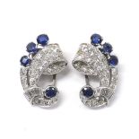 Pair of Art Deco sapphire and diamond white metal clips, of cornucopia design each with four round