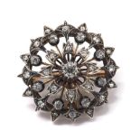 Attractive antique circular pierced diamond brooch/pendant, old round-cut diamonds set in white