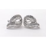 Attractive pair of modern 18k white gold diamond earrings, set with baguette and round brilliant-cut