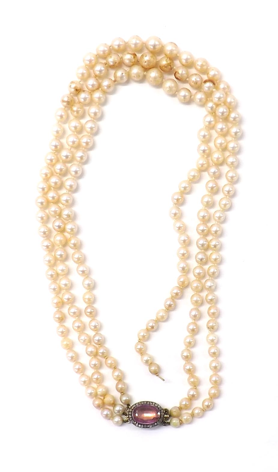 Cultured pearl three strand necklet with an oval andalusite and rose diamond set clasp, pearls