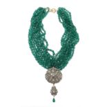 Continental rough-cut diamond and emerald pendant on a ten strand green hardstone bead necklet,