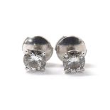 Pair of 18k white gold diamond ear studs, round brilliant-cuts in a four claw setting, 0.49ct & 0.