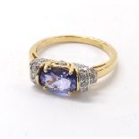 18ct tanzanite and diamond ring, the oval tanzanite 1.14ct approx, 3.7gm, ring size N