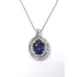 Attractive 14ct blue sapphire and diamond oval pendant on a slender chain, sapphire 1.76ct, the