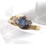 Sapphire and diamond 9ct three stone ring in a crossover setting, 3.8gm, ring size L/L-