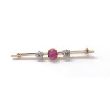 Cabouchon ruby and old-cut diamond bar brooch, the oval ruby 1.42ct approx, flanked by two round