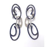 Pair of 18k white gold sapphire and diamond drop earrings, with triple oval open work links set with