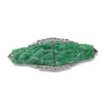 Attractive white gold carved jade and diamond double clip brooch in the Art Deco style, with foliate