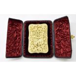 Fine quality Chinese Canton ivory serpentine card case, 19th century, intricately carved with