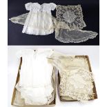 Nine various white silk and embroidered christening dresses and other garments; also a small