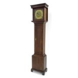 Small oak thirty hour longcase clock, the 9" square brass dial with brass chapter ring enclosing a