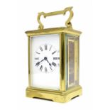 Brass cased carriage clock timepiece, 7" high including handle (with winding key)