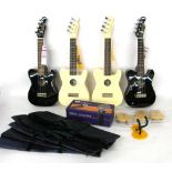 Four Mahalo ukuleles; together with four Mahalo ukulele wall hangers, a TGI microphone, a microphone