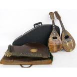 Two Neapolitan bowl back mandolins in need of restoration, one labelled Carlo Loveri & Figlio;