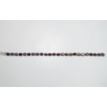 Indian Garnet Tennis Bracelet, 26cts of the rich red and blackcurrant toned garnet set in platinum