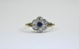 18 ct Gold Set Sapphire And Diamond Cluster Ring Flower head setting. The central Sapphire