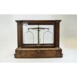 Glass cases lab scales, dating from the late 19th Century or early 20th Century.