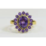 Amethyst Cluster Ring, an oval cut purple amethyst of 2.5cts, bezel set and framed with fourteen