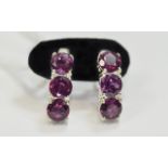 Rhodolite Garnet J-Hoop Earrings, three round cut, faceted, plum colour garnets set in silver post