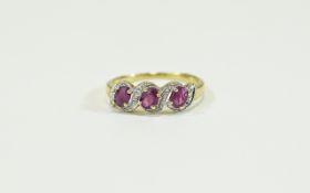 9ct Gold Diamond & Ruby Ring. 3 Oval cut rubies between diamond set spacers.