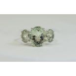 Green Amethyst Three Stone Ring, a 5ct oval cut green amethyst flanked by two further green