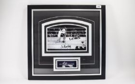 Boxing Interest. Signed photo Sir Henry Cooper. Black glazed frame. Ideal collectors or charity